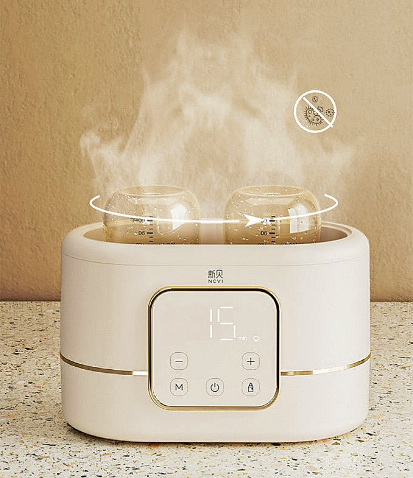 NCVI double bottle warmer + sterilizer.