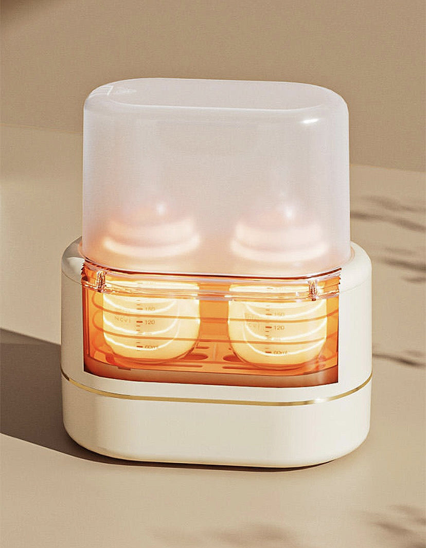 NCVI double bottle warmer + sterilizer.