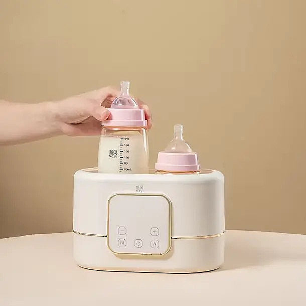 NCVI double bottle warmer + sterilizer.